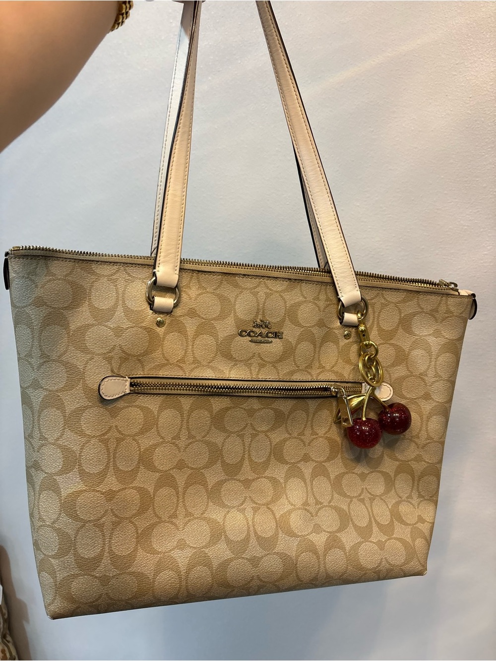 Coach Beige Signature Canvas Tote with Red Cherry Charm